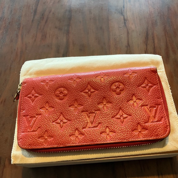 Louis Vuitton Handbags - Louis Vuitton zip around Embossed Wallet in good used condition!